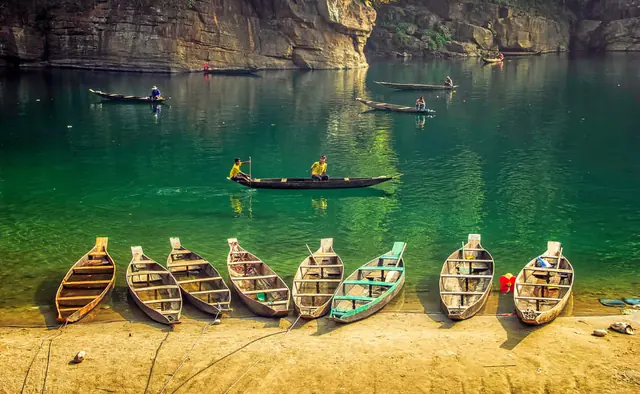 Wooden boats on the green Umngot River at Dawki, Meghalaya