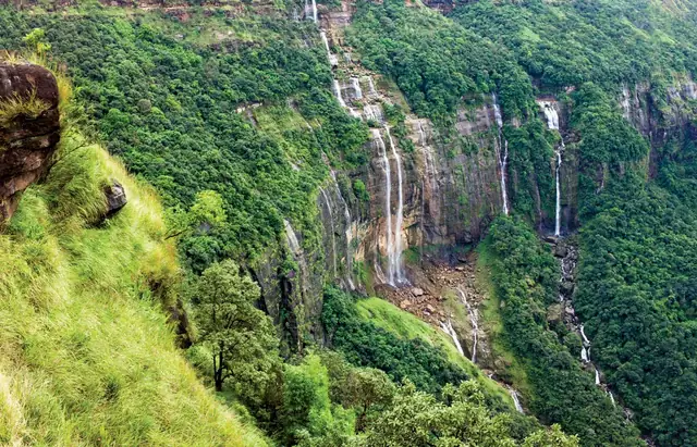 Waterfalls pouring off forested cliffs near Cherrapunji, Meghalaya